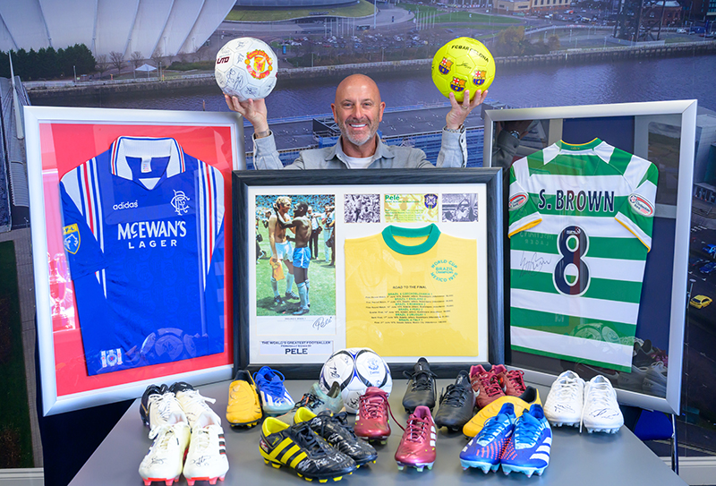 John Horne with collection of sports memmorabilia