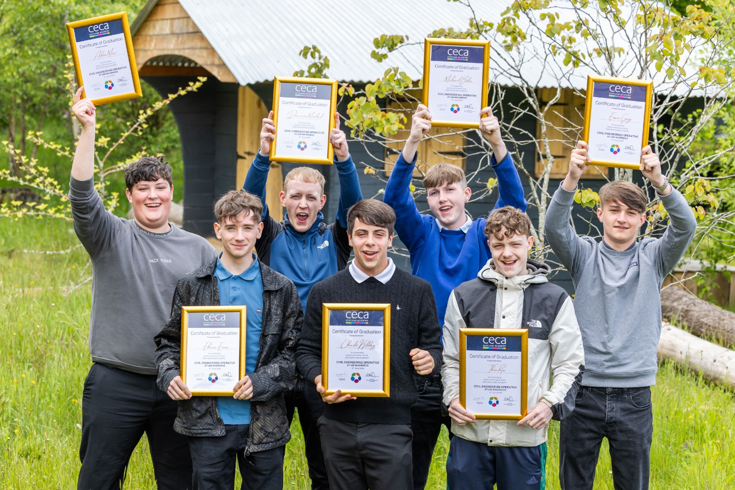 Students holding up their certificates