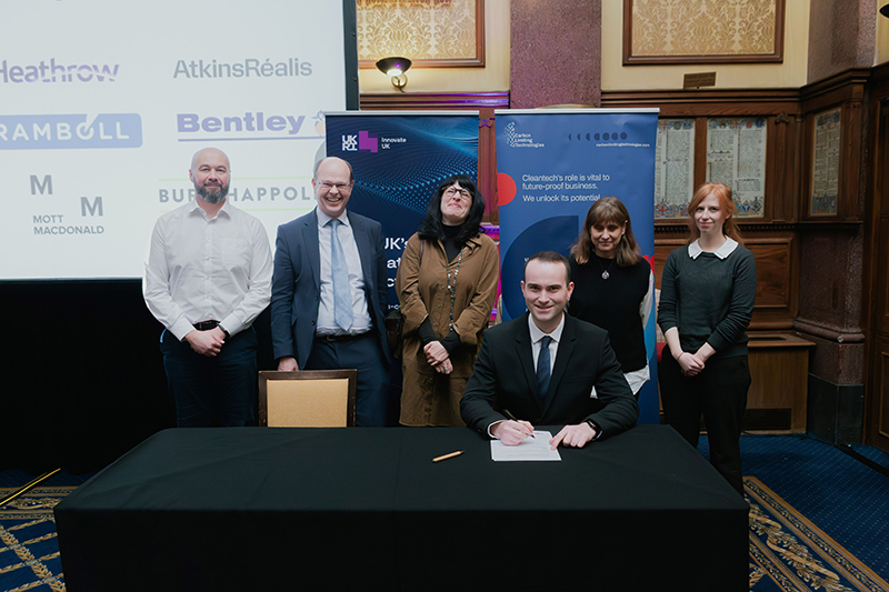 Scottish Water's Chris Arnold signing the AMC
